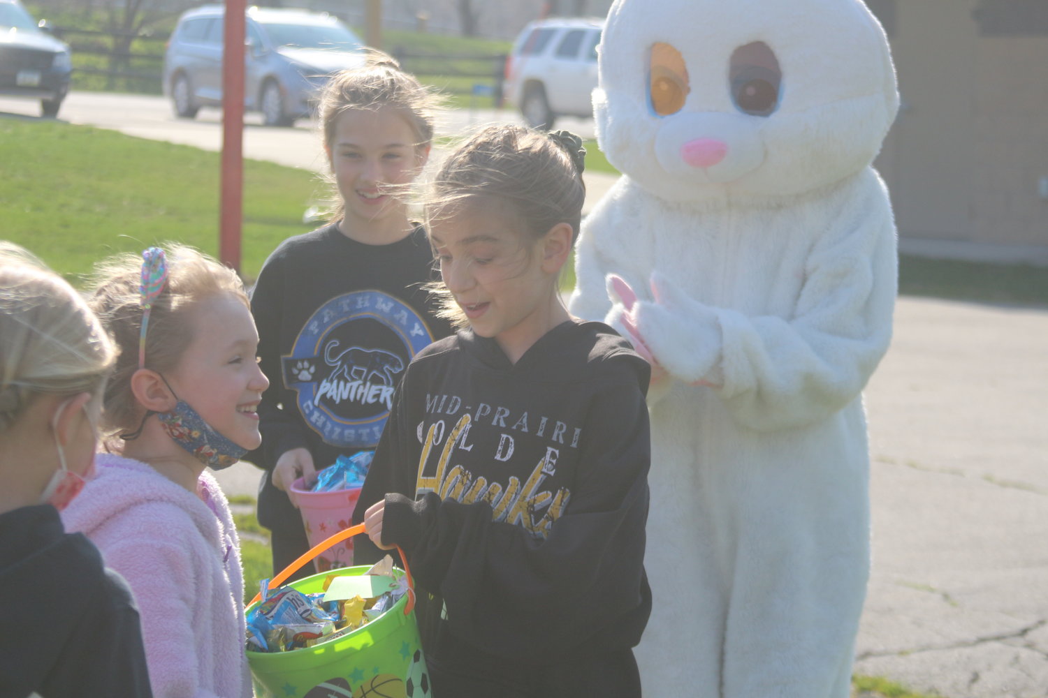 Kids enjoy finding eggs at the Kalona Historical Village Easter egg hunt on Saturday, April 3.